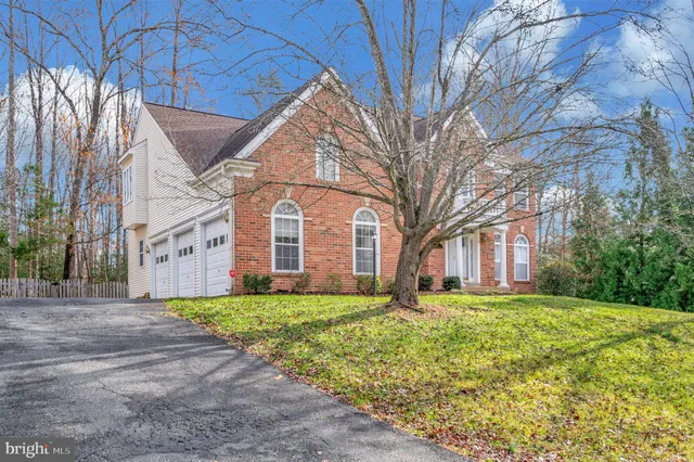 a front view of a building with a garden