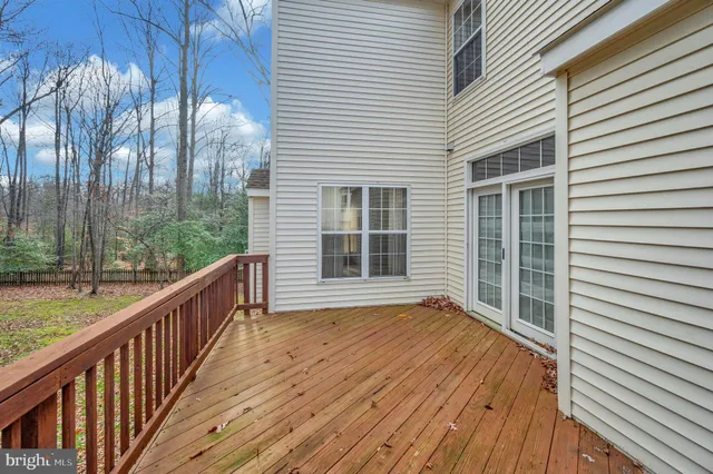 a view of a large white house with large windows