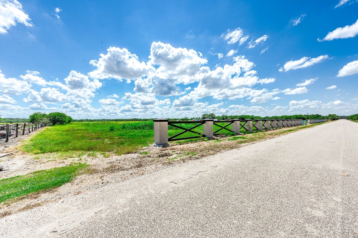 13931 Routt Point Road Needville, TX 77461 - Photo 11 of 11 a view of a street with a yard