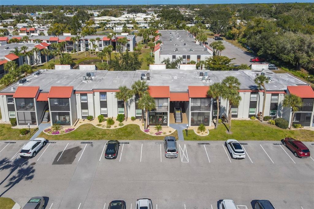 an aerial view of residential houses and lake view