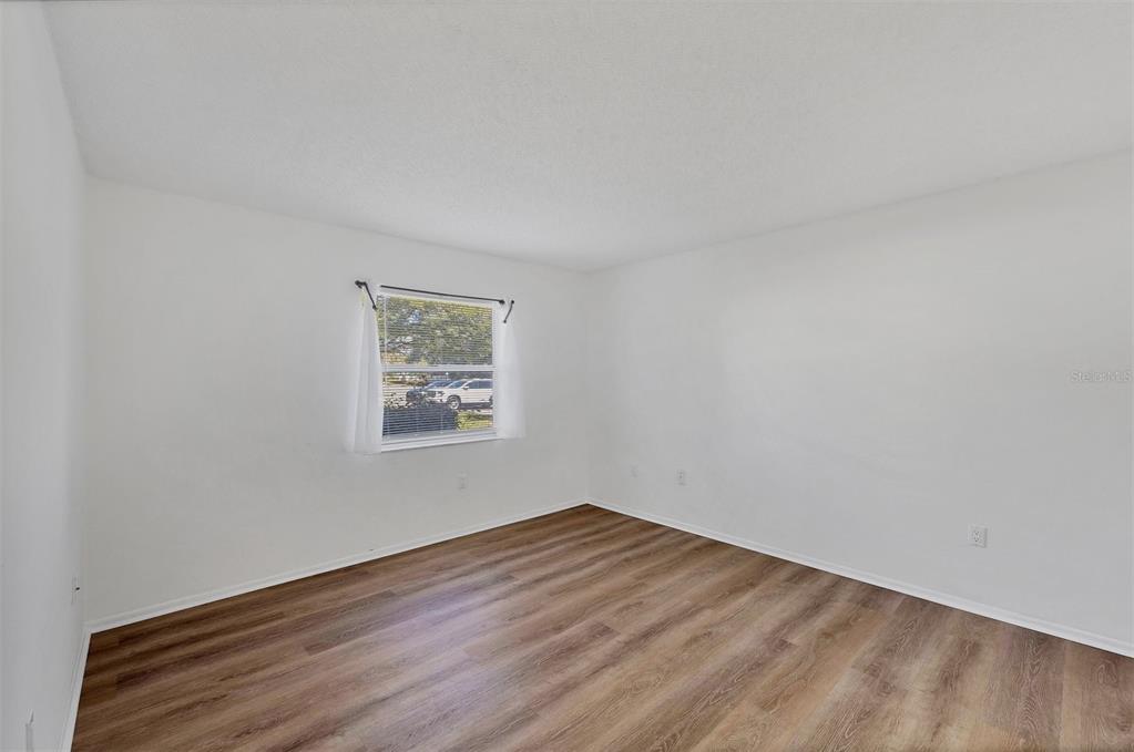 3231 South Beneva Road, Unit 103 Sarasota, FL 34232 - Photo 13 of 31 wooden floor in a room