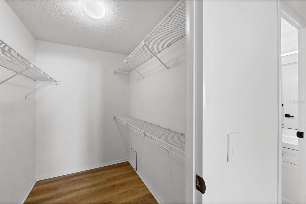 3231 South Beneva Road, Unit 103 Sarasota, FL 34232 - Photo 14 of 31 a view of small space with racks on the wall