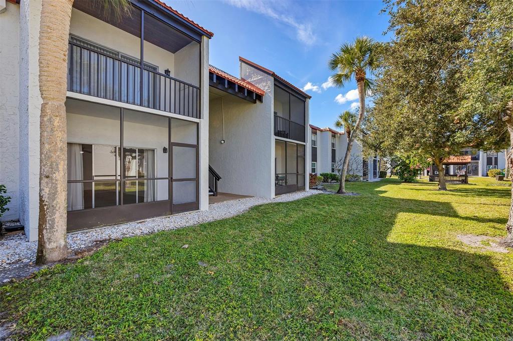 3231 South Beneva Road, Unit 103 Sarasota, FL 34232 - Photo 20 of 31 a view of a house with a yard