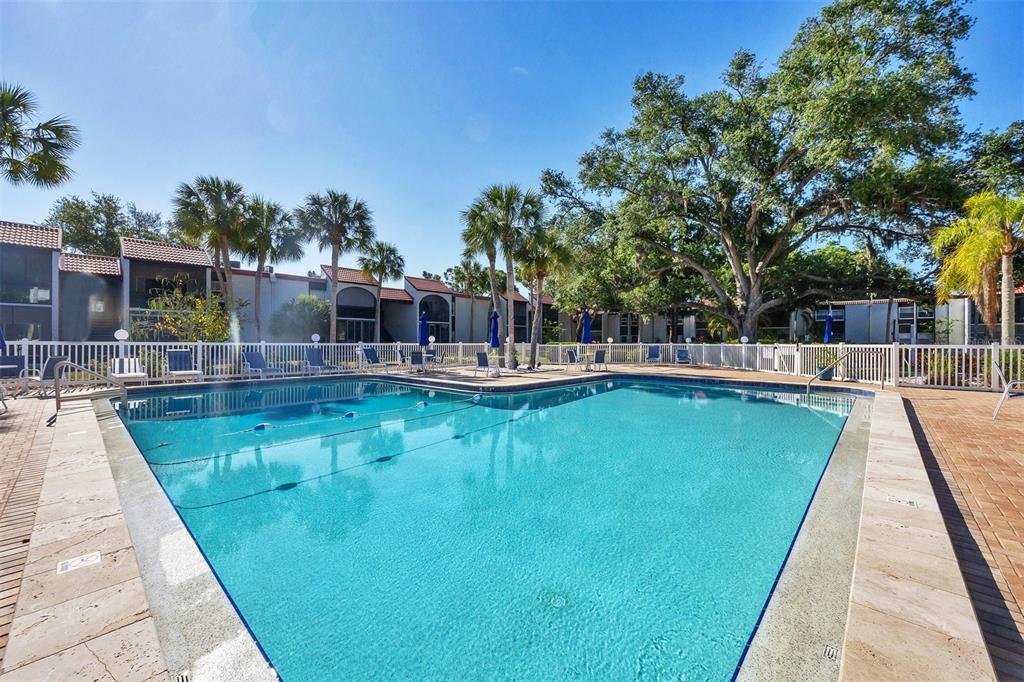 3231 South Beneva Road, Unit 103 Sarasota, FL 34232 - Photo 27 of 31 a view of a swimming pool with sitting area