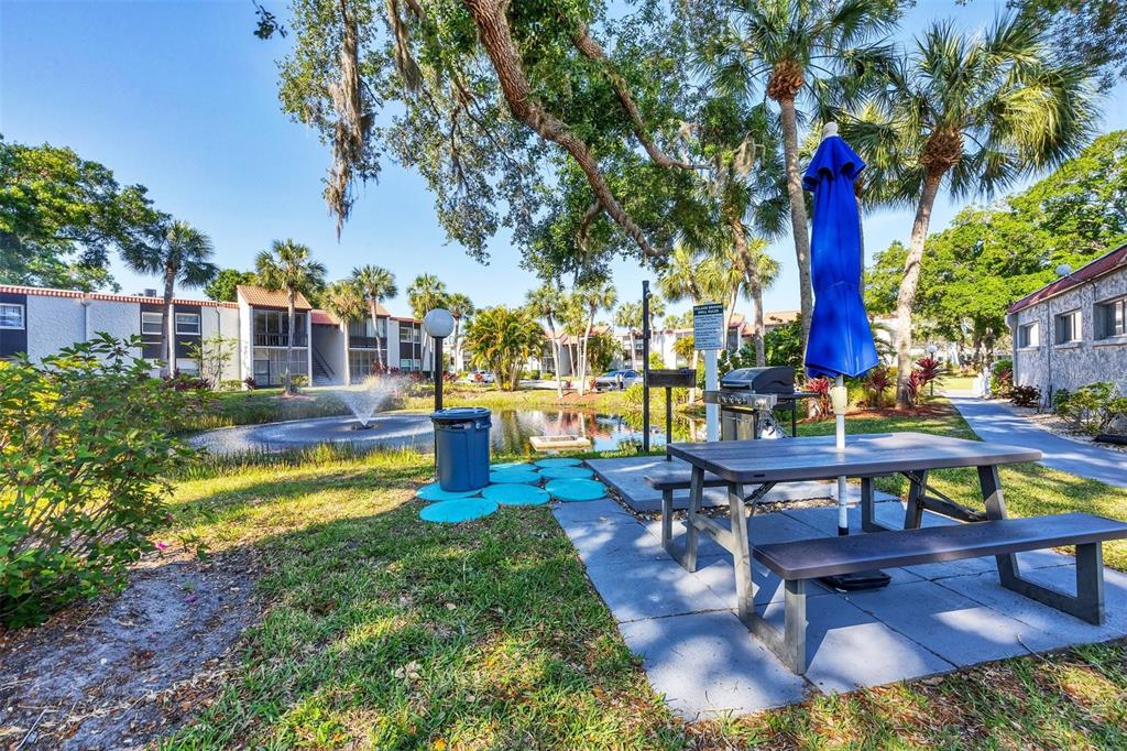3231 South Beneva Road, Unit 103 Sarasota, FL 34232 - Photo 30 of 31 a swimming pool with outdoor seating yard and outdoor seating