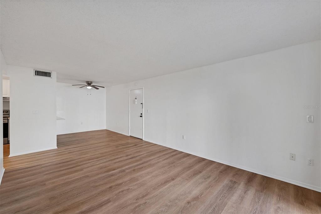 3231 South Beneva Road, Unit 103 Sarasota, FL 34232 - Photo 3 of 31 a view of empty room with wooden floor