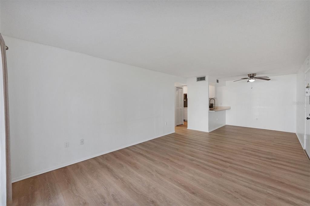 3231 South Beneva Road, Unit 103 Sarasota, FL 34232 - Photo 4 of 31 a view of empty room with wooden floor