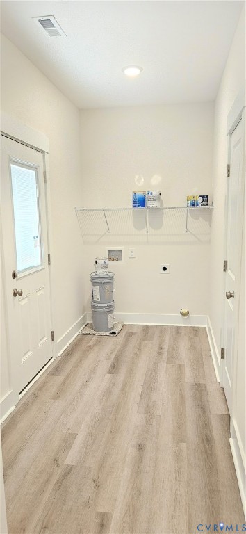 2982 Ashdale Road Center Cross, VA 22437 - Photo 20 of 23 Utility room featuring wood-finish flooring, a flu