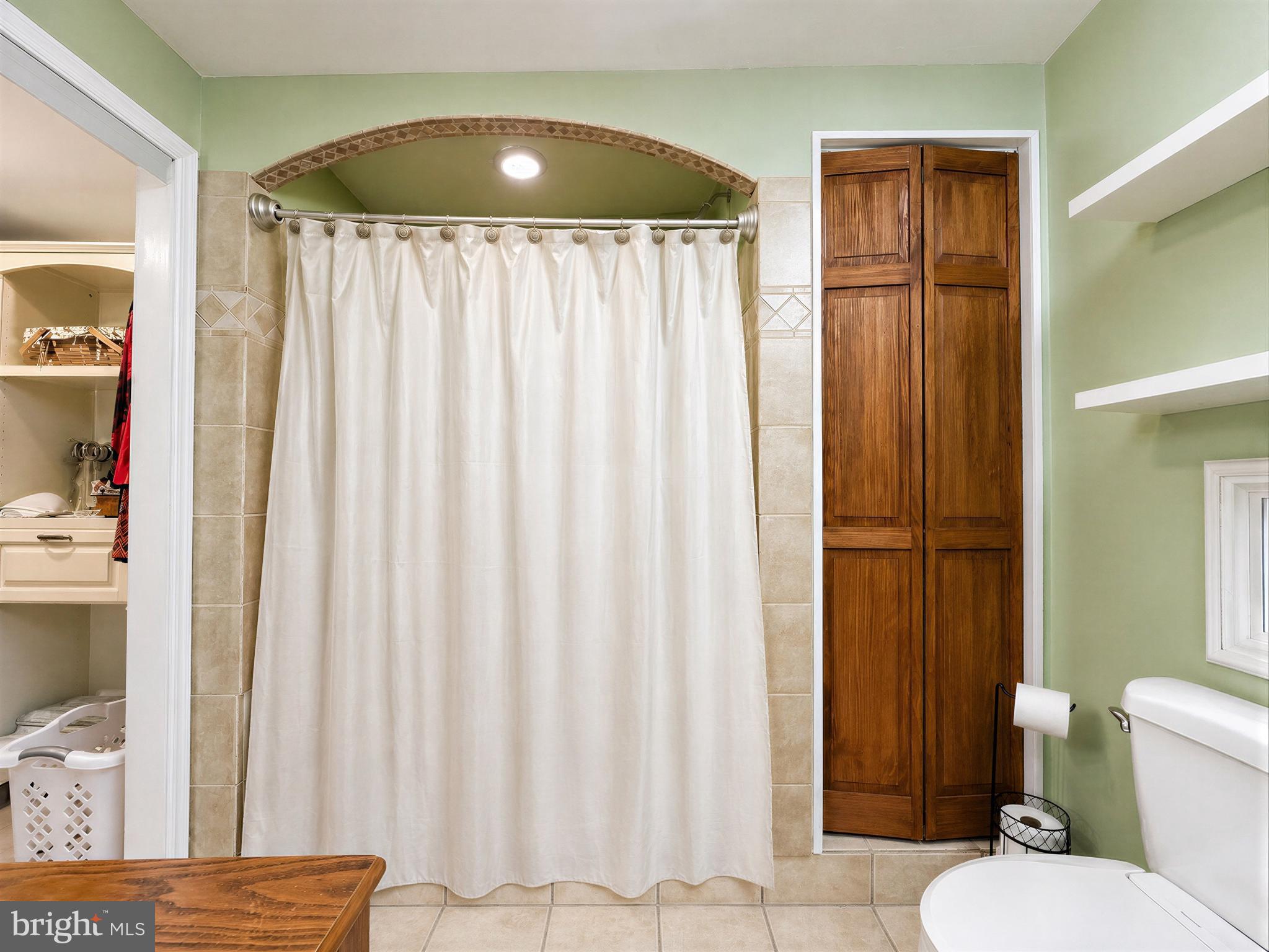 17773 Piney Point Road Piney Point, MD 20674 - Photo 28 of 67 Primary Bathroom boasting linen storage