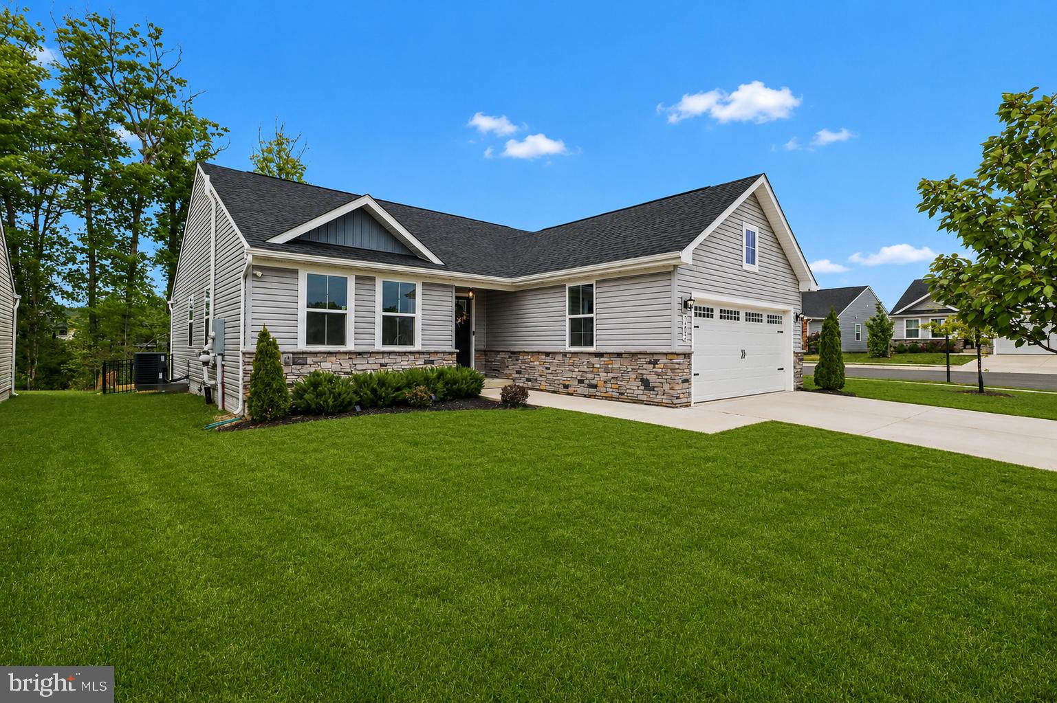 7202 Parchment Circle Ruther Glen, VA 22546 - Photo 3 of 30 a front view of house with yard and green space