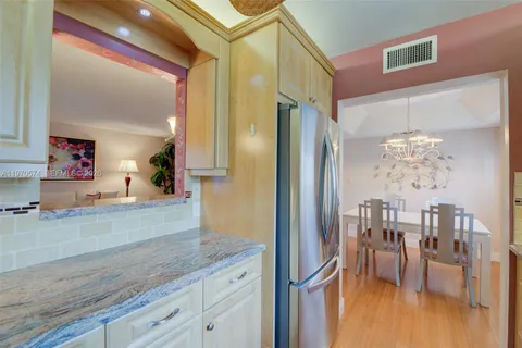 a view of a living room and chandelier