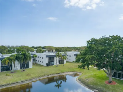 a view of a lake with a yard