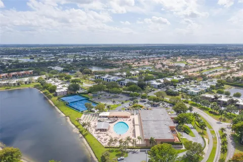 an aerial view of residential houses with outdoor space