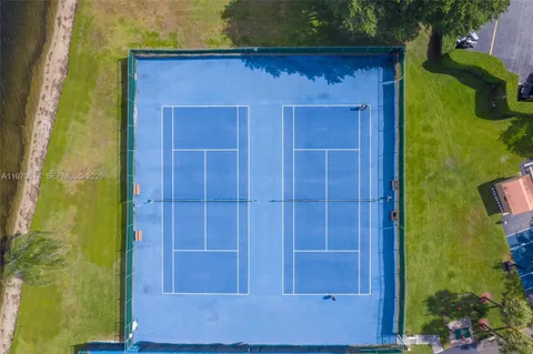 a view of a swimming pool with a table and chairs