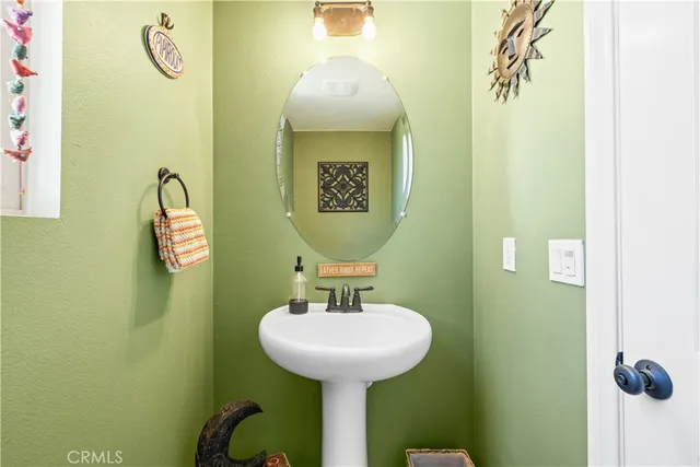 a bathroom with a sink and mirror
