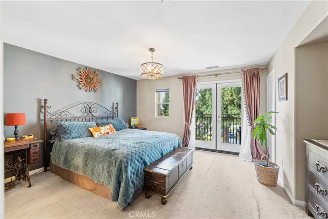 a bedroom with a bed and a table