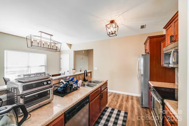 a kitchen with a stove and a microwave