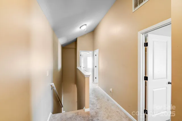 a view of a hallway with windows