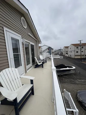 a terrace of a house with outdoor seating