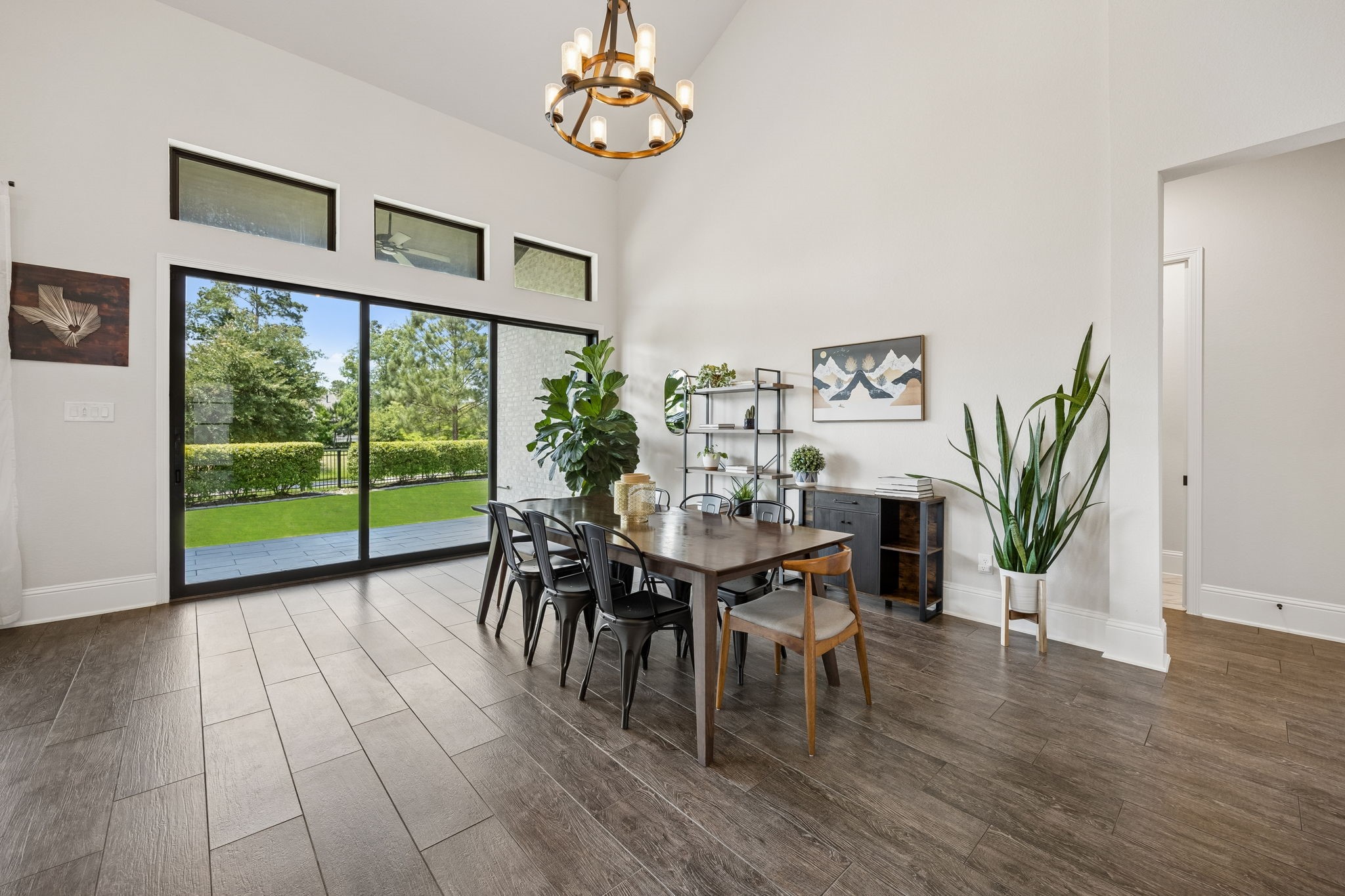 10102 South Goshawk Trail Conroe, TX 77385 - Photo 10 of 46 a view of a dining room with furniture window and wooden floor