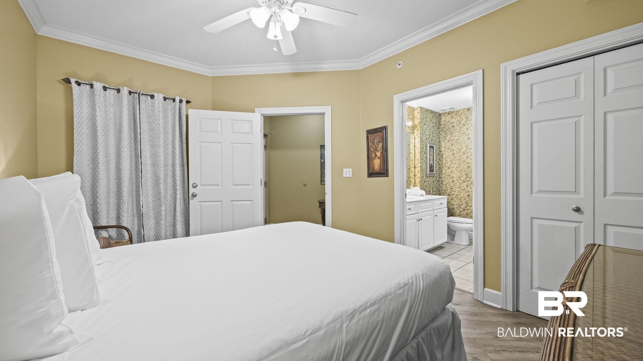 27580 Canal Road, Unit 214 BS 62 Orange Beach, AL 36561 - Photo 13 of 23 Bedroom with ornamental molding, light wood finished floors, a ceiling fan, and connected bathroom
