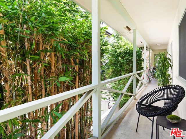 a view of a balcony with chairs