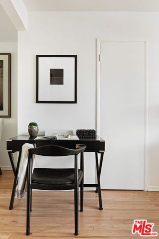 a view of a livingroom with furniture and wooden floor