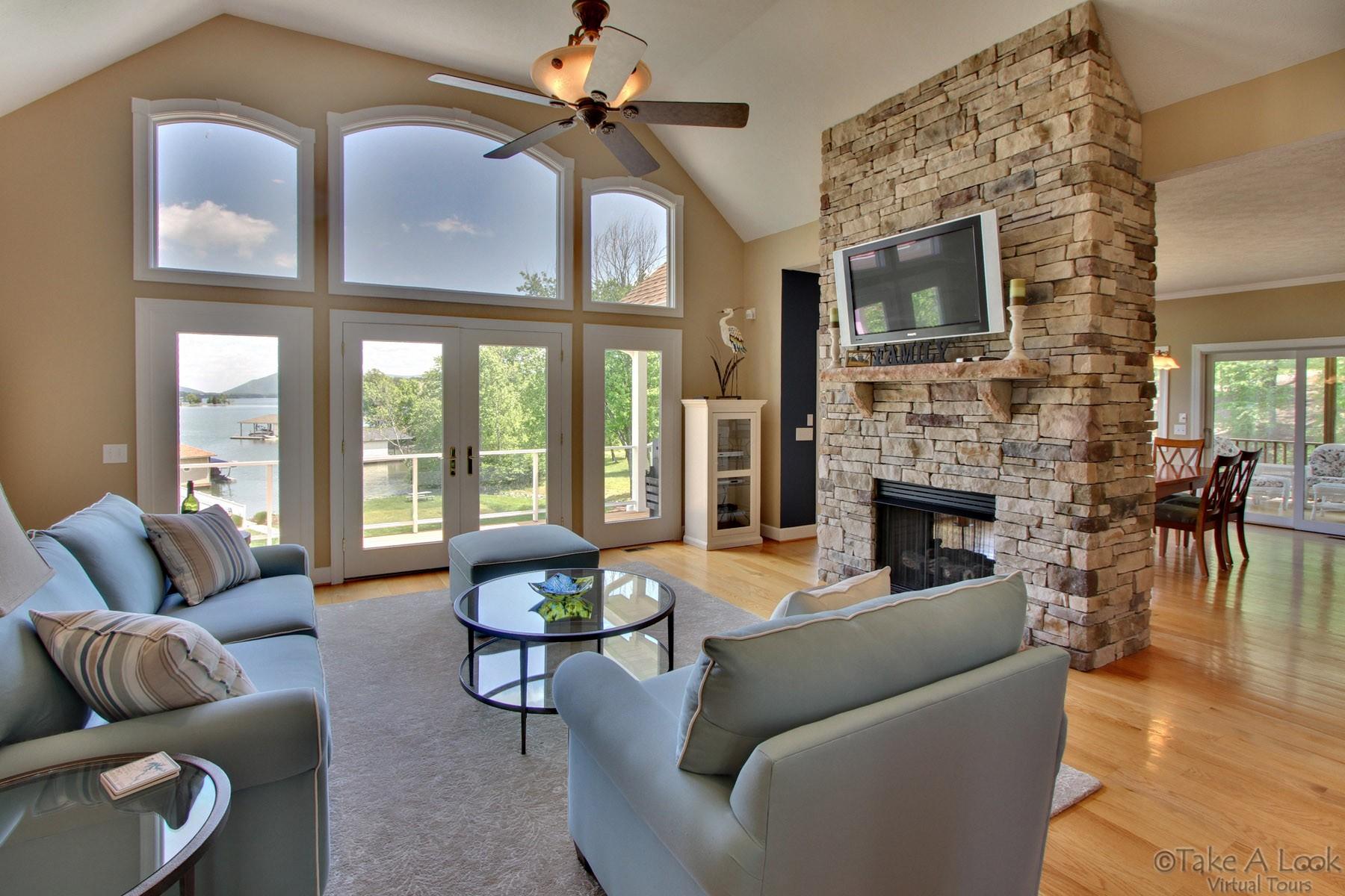 140 Calypso Road Moneta, VA 24121 - Photo 6 of 26 a living room with furniture fireplace and flat screen tv