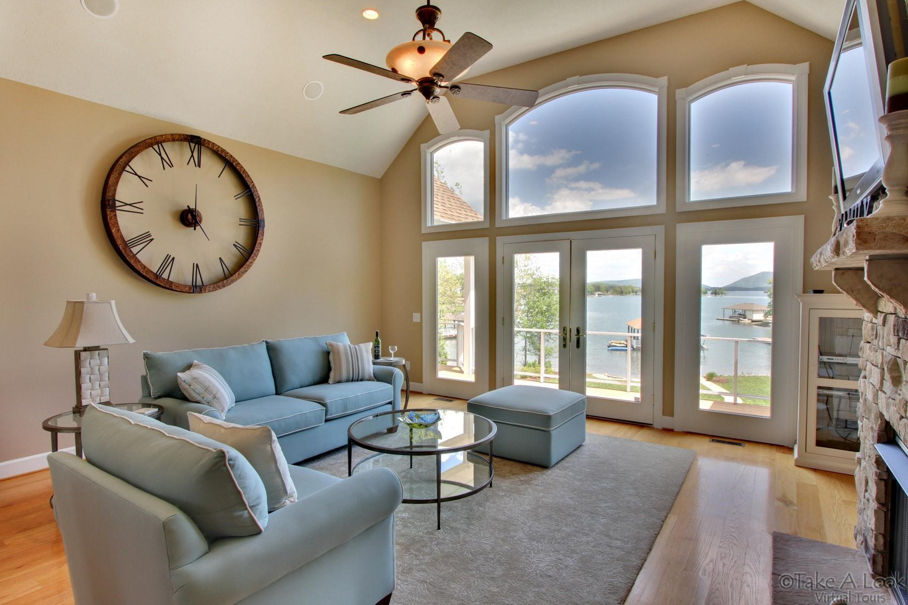140 Calypso Road Moneta, VA 24121 - Photo 7 of 26 a living room with furniture a fireplace and a large window