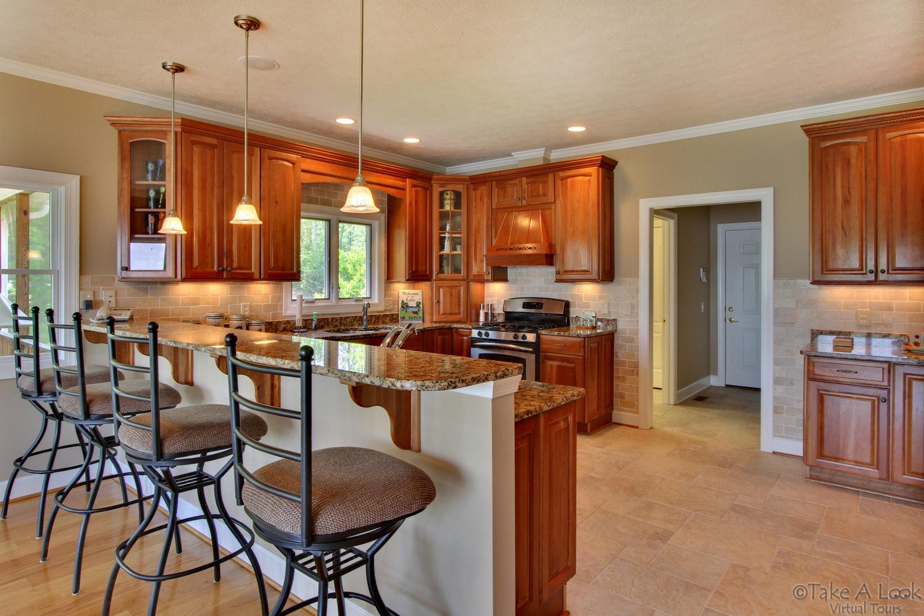 140 Calypso Road Moneta, VA 24121 - Photo 9 of 26 a kitchen with granite countertop lots of counter top space and furniture