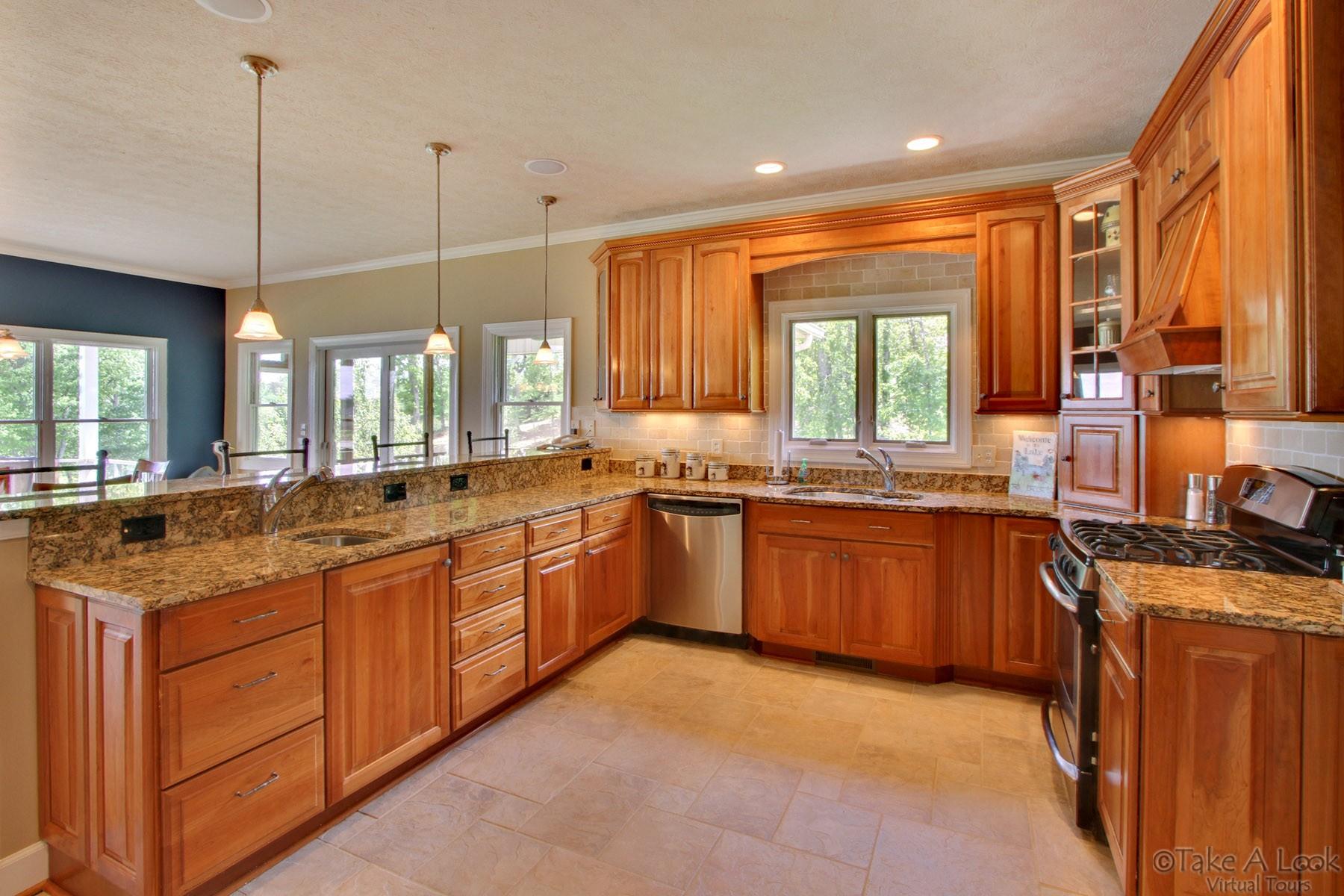 140 Calypso Road Moneta, VA 24121 - Photo 10 of 26 a large kitchen with kitchen island granite countertop a large window