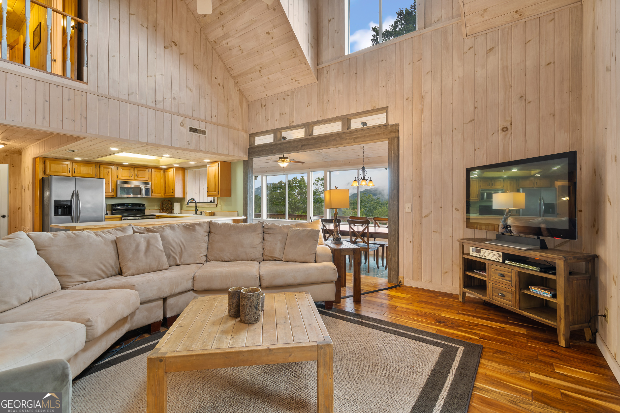 1387 Valley Street Clayton, GA 30525 - Photo 11 of 59 a living room with furniture and a flat screen tv