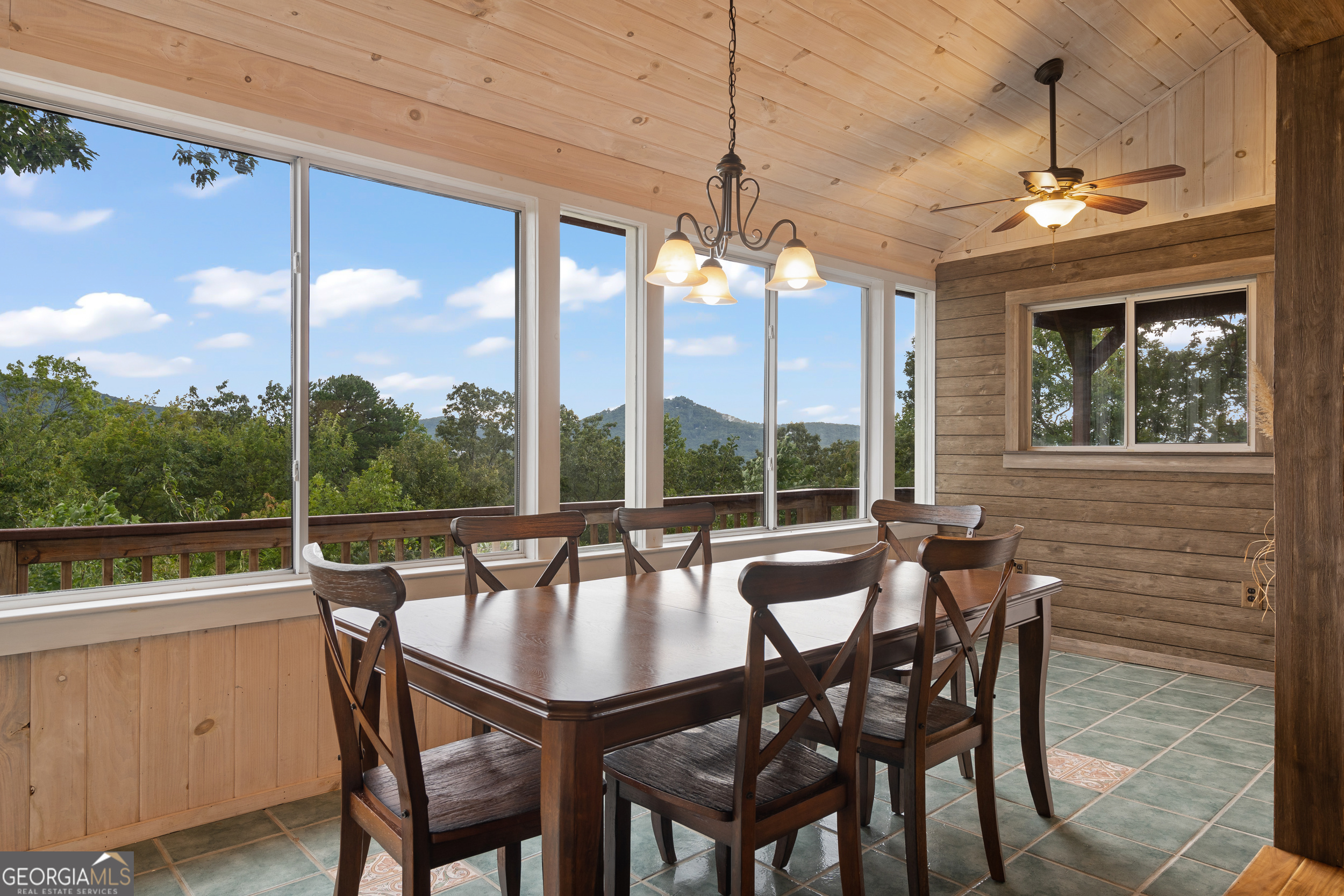 1387 Valley Street Clayton, GA 30525 - Photo 13 of 59 a dining room with furniture a chandelier and wooden floor