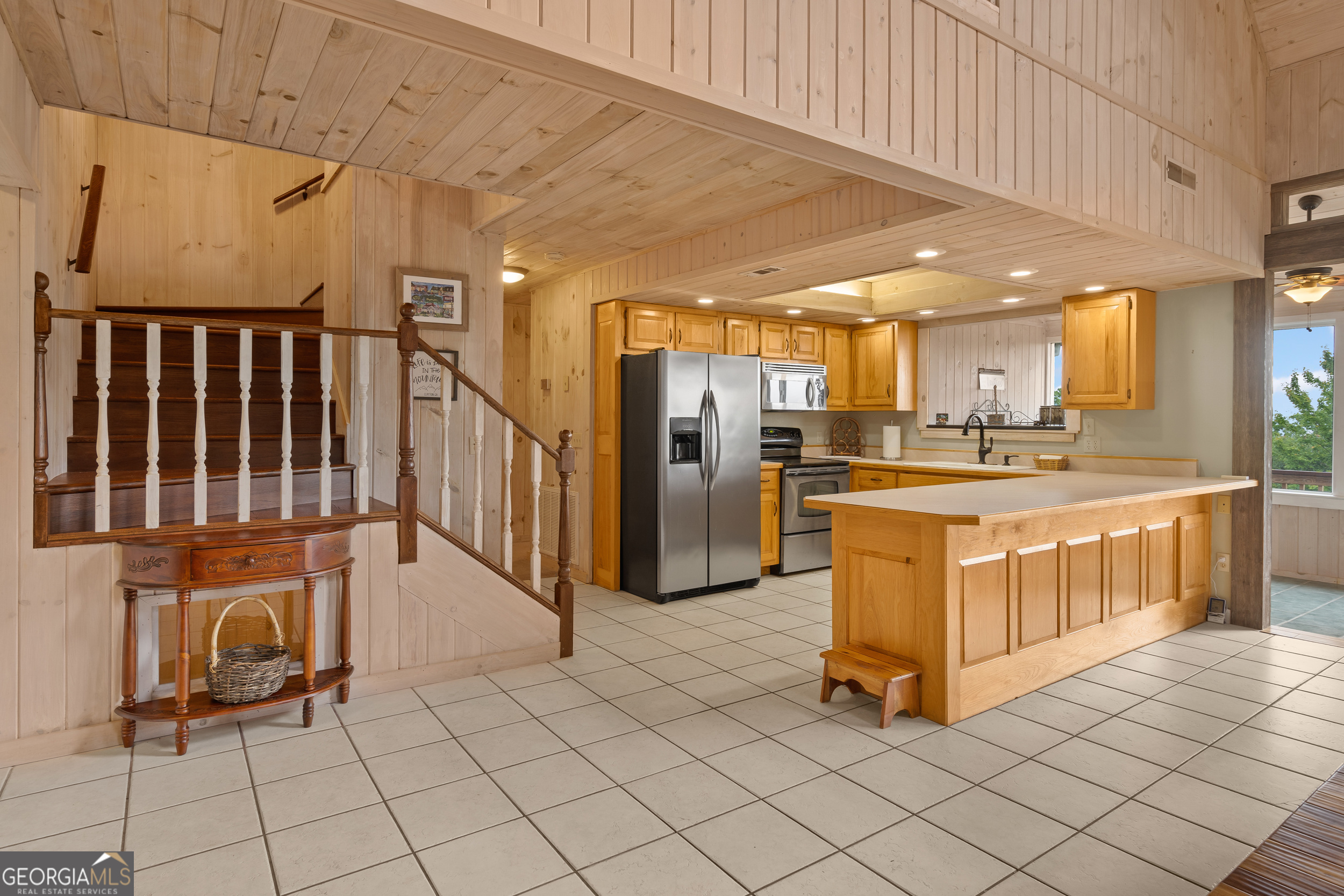 1387 Valley Street Clayton, GA 30525 - Photo 18 of 59 a kitchen with stainless steel appliances kitchen island granite countertop a refrigerator a stove a oven and white cabinets