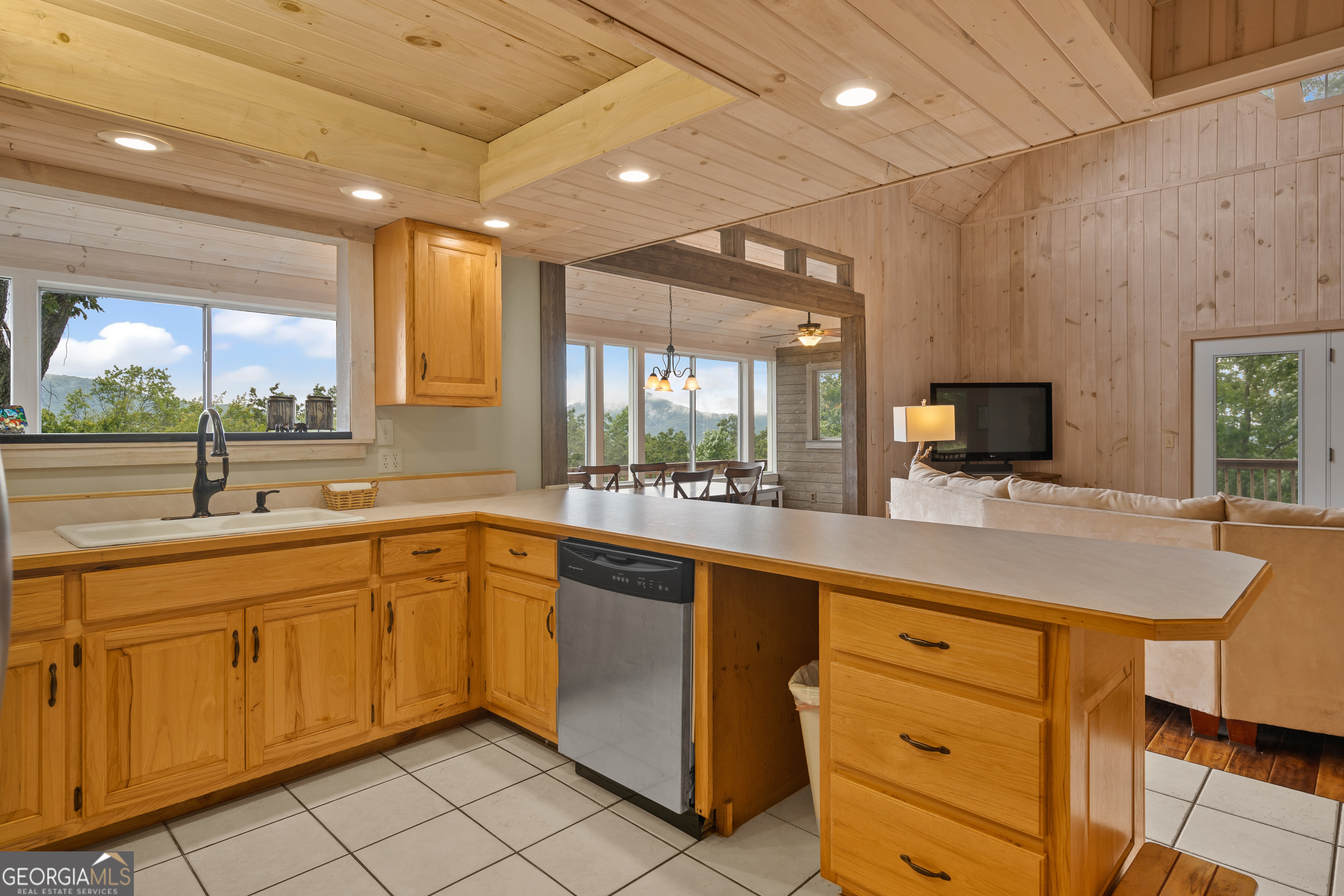 1387 Valley Street Clayton, GA 30525 - Photo 20 of 59 a kitchen with sink cabinets and window