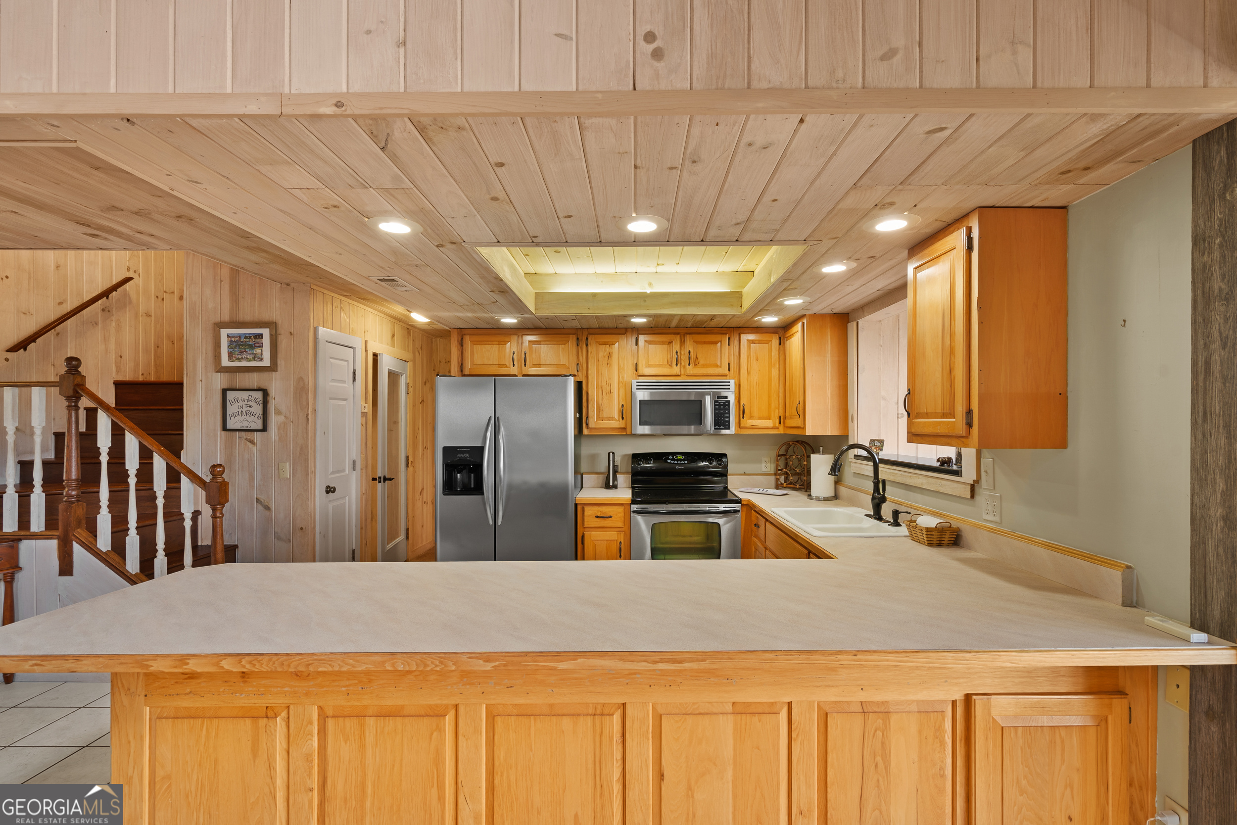 1387 Valley Street Clayton, GA 30525 - Photo 21 of 59 a large kitchen with stainless steel appliances a large counter top