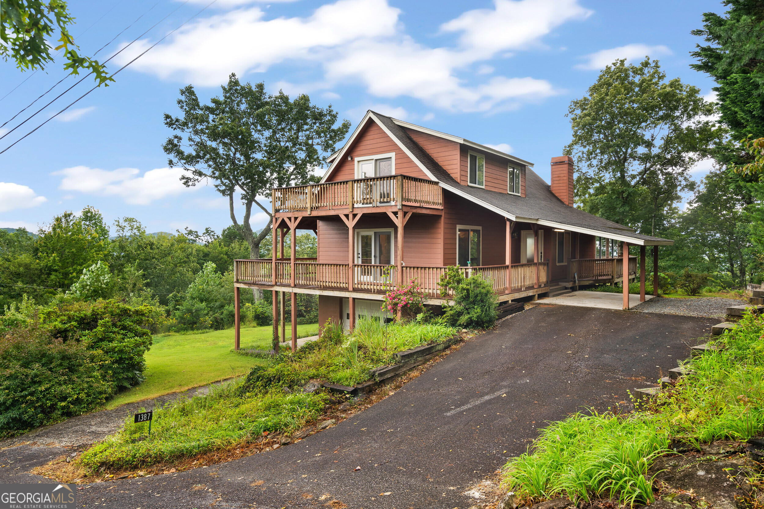 1387 Valley Street Clayton, GA 30525 - Photo 3 of 59 a house view with a garden space