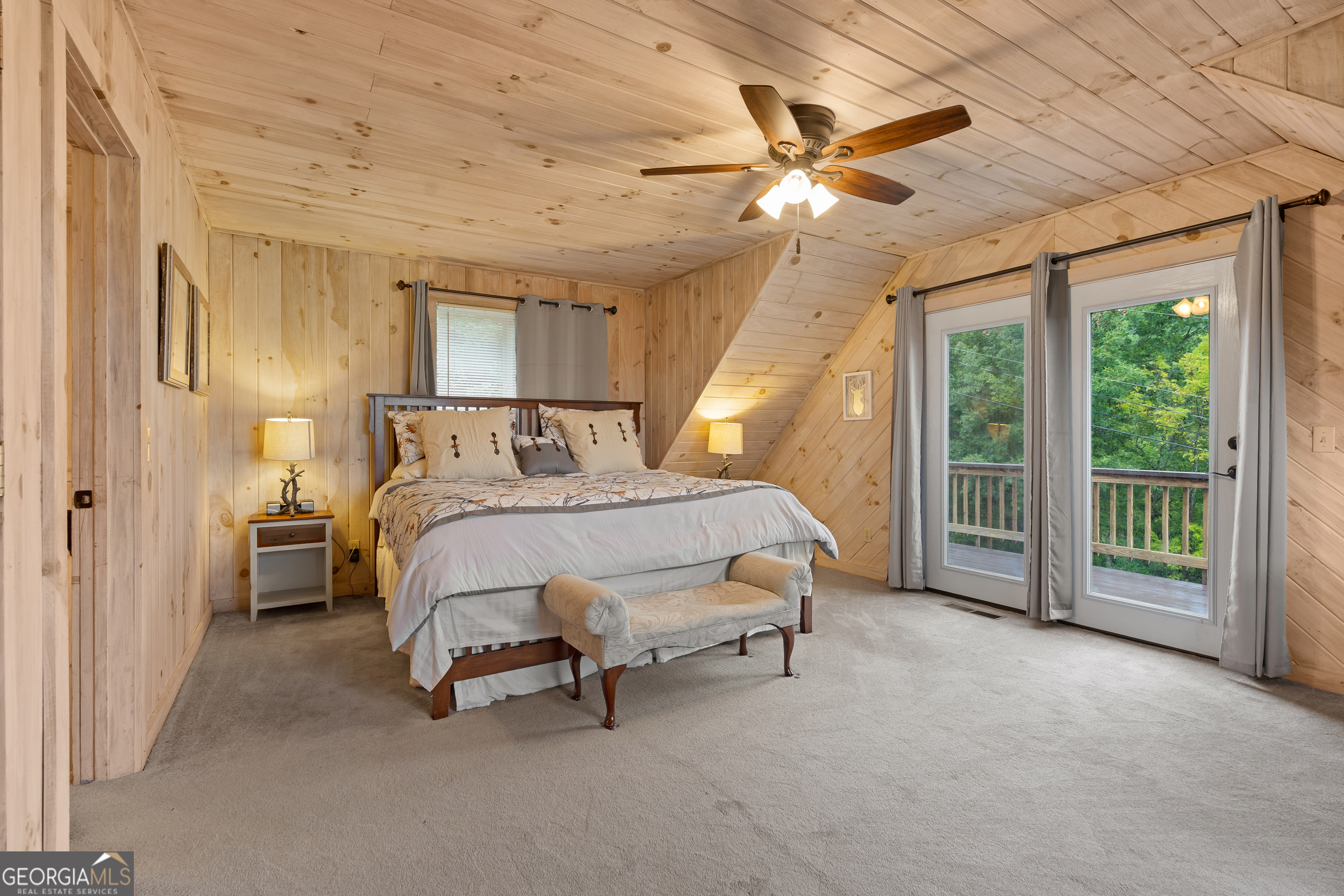 1387 Valley Street Clayton, GA 30525 - Photo 33 of 59 a bed room with a bed and a chandelier