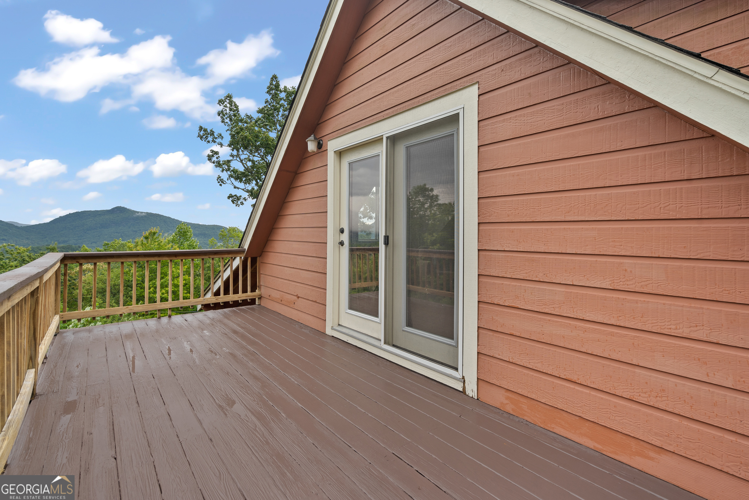 1387 Valley Street Clayton, GA 30525 - Photo 36 of 59 a view of a balcony with wooden floor and fence