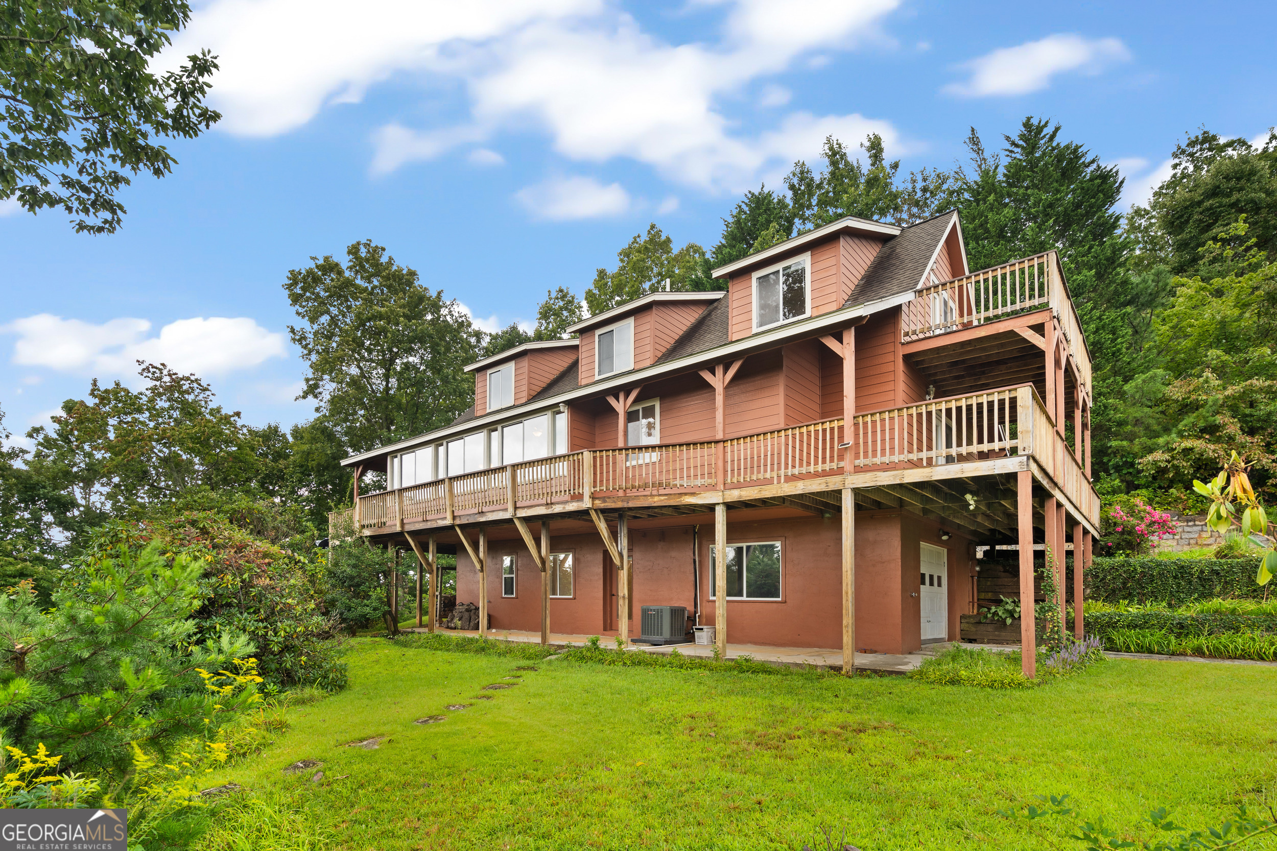 1387 Valley Street Clayton, GA 30525 - Photo 4 of 59 a front view of a house with a garden