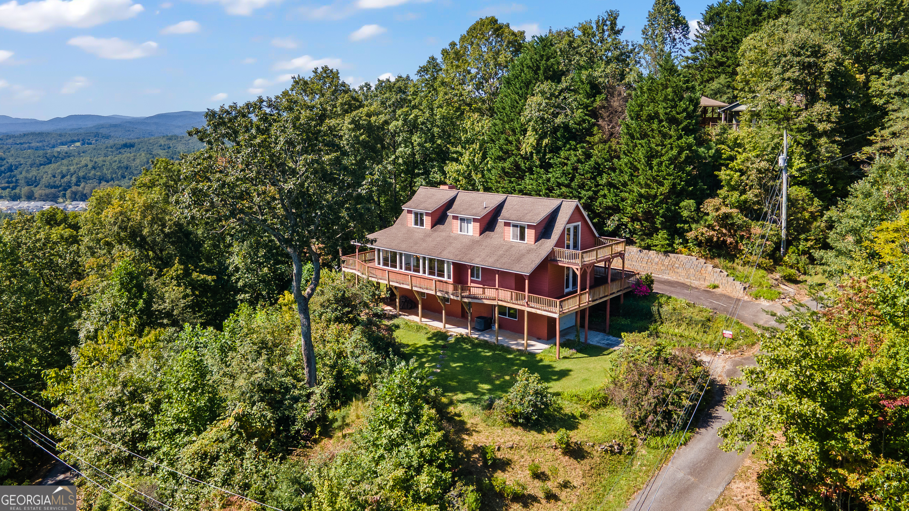 1387 Valley Street Clayton, GA 30525 - Photo 52 of 59 an aerial view of a house with a big yard and large trees