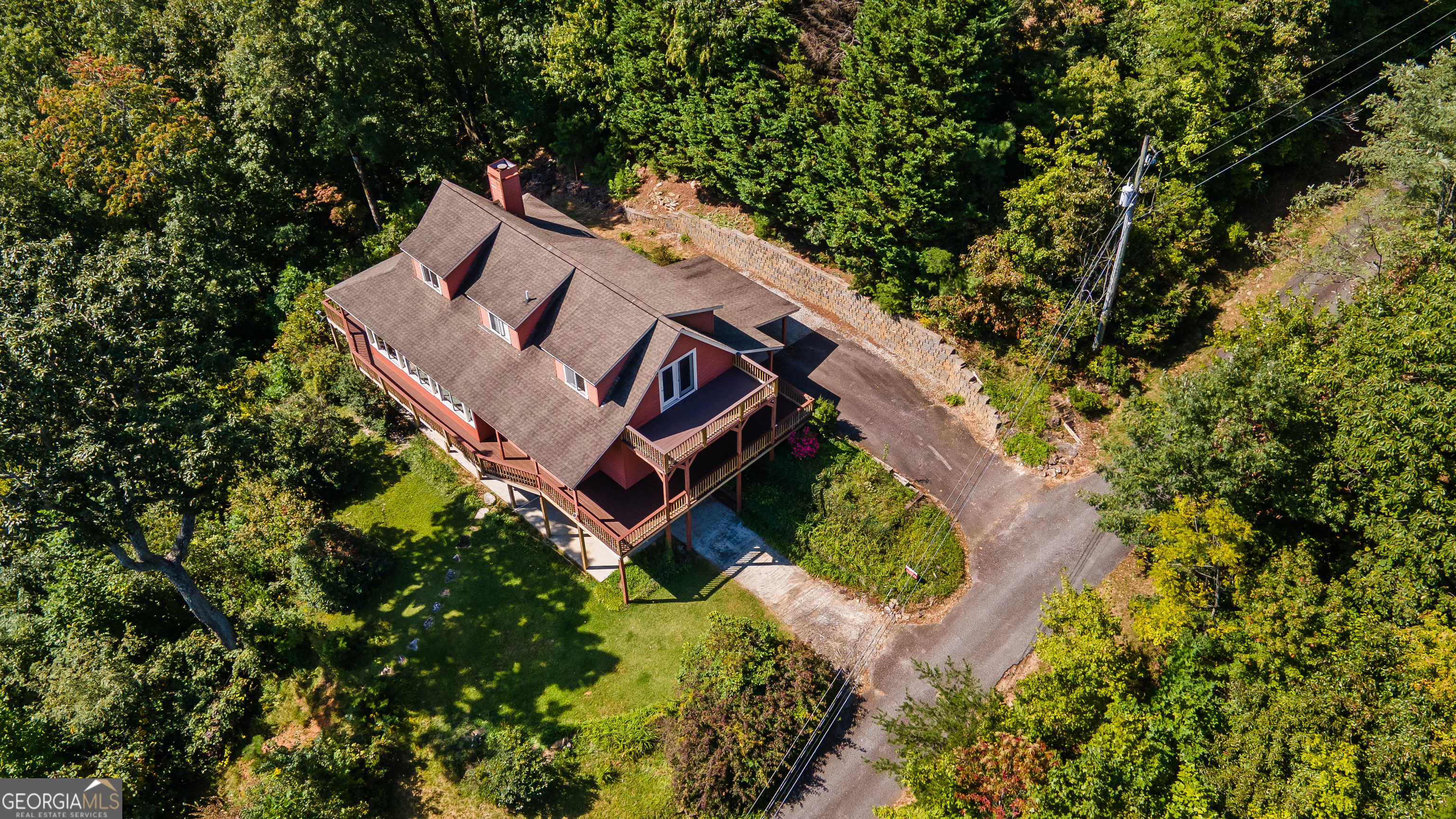 1387 Valley Street Clayton, GA 30525 - Photo 54 of 59 an aerial view of a house with a yard and trees