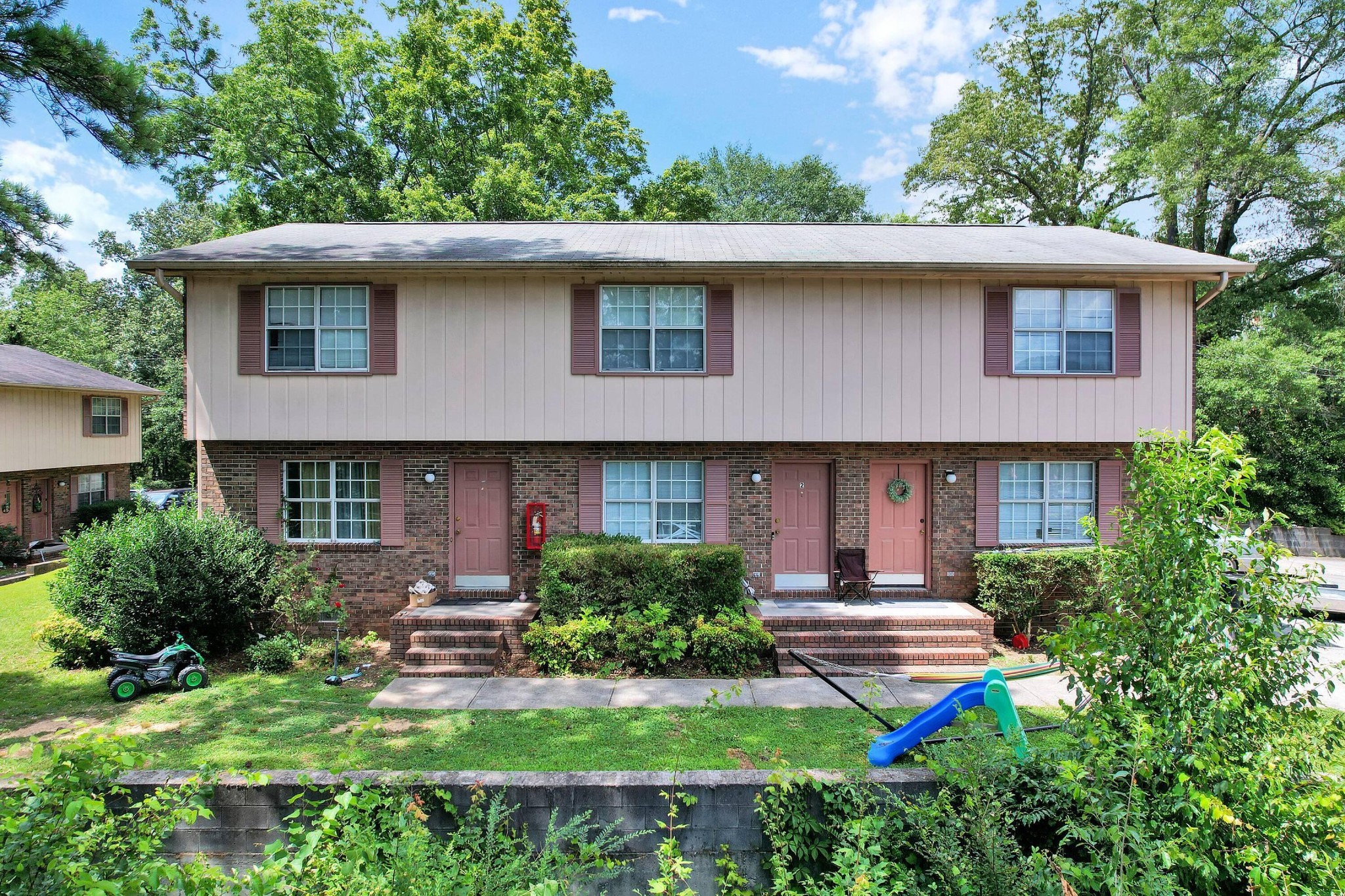 207 April Street Dalton, GA 30720 - Photo 1 of 2 a front view of a house with a yard