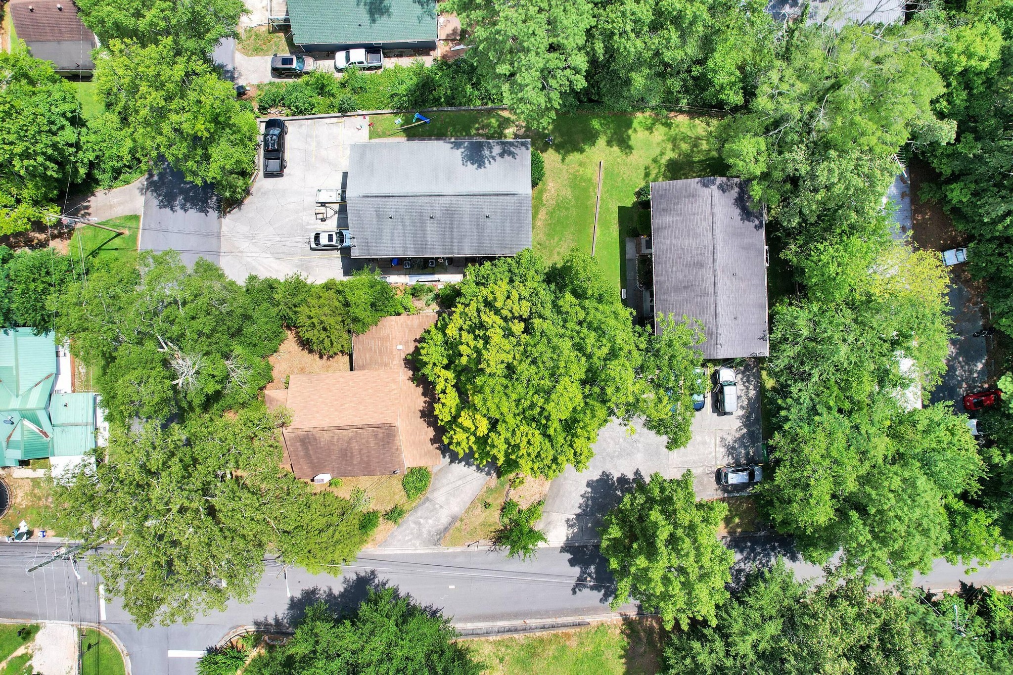 207 April Street Dalton, GA 30720 - Photo 2 of 2 an aerial view of a house with a yard and large trees