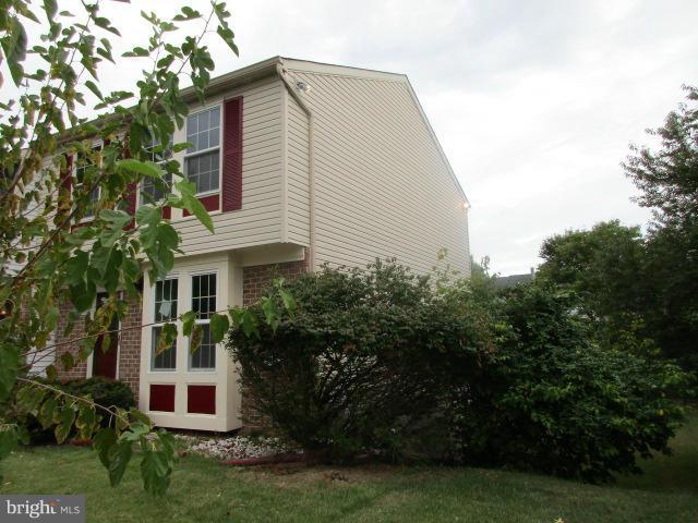 1306 Apple Ridge Court Edgewood, MD 21040 - Photo 3 of 27 a front view of a house with a garden
