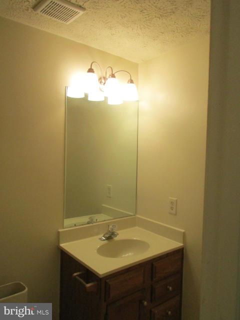 1306 Apple Ridge Court Edgewood, MD 21040 - Photo 22 of 27 a bathroom with a sink and vanity