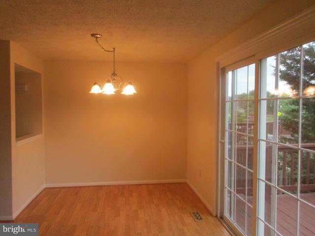 1306 Apple Ridge Court Edgewood, MD 21040 - Photo 8 of 27 a view of a room with wooden floor and windows