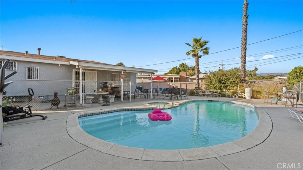215 West Valencia Street Rialto, CA 92376 - Photo 13 of 17 a view of a swimming pool with a patio