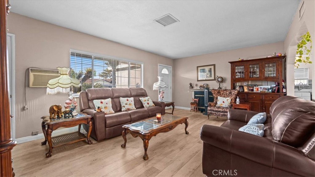 215 West Valencia Street Rialto, CA 92376 - Photo 4 of 17 a living room with furniture and a potted plant