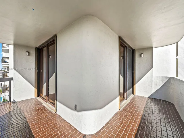 a kitchen with white cabinets stainless steel appliances and sink